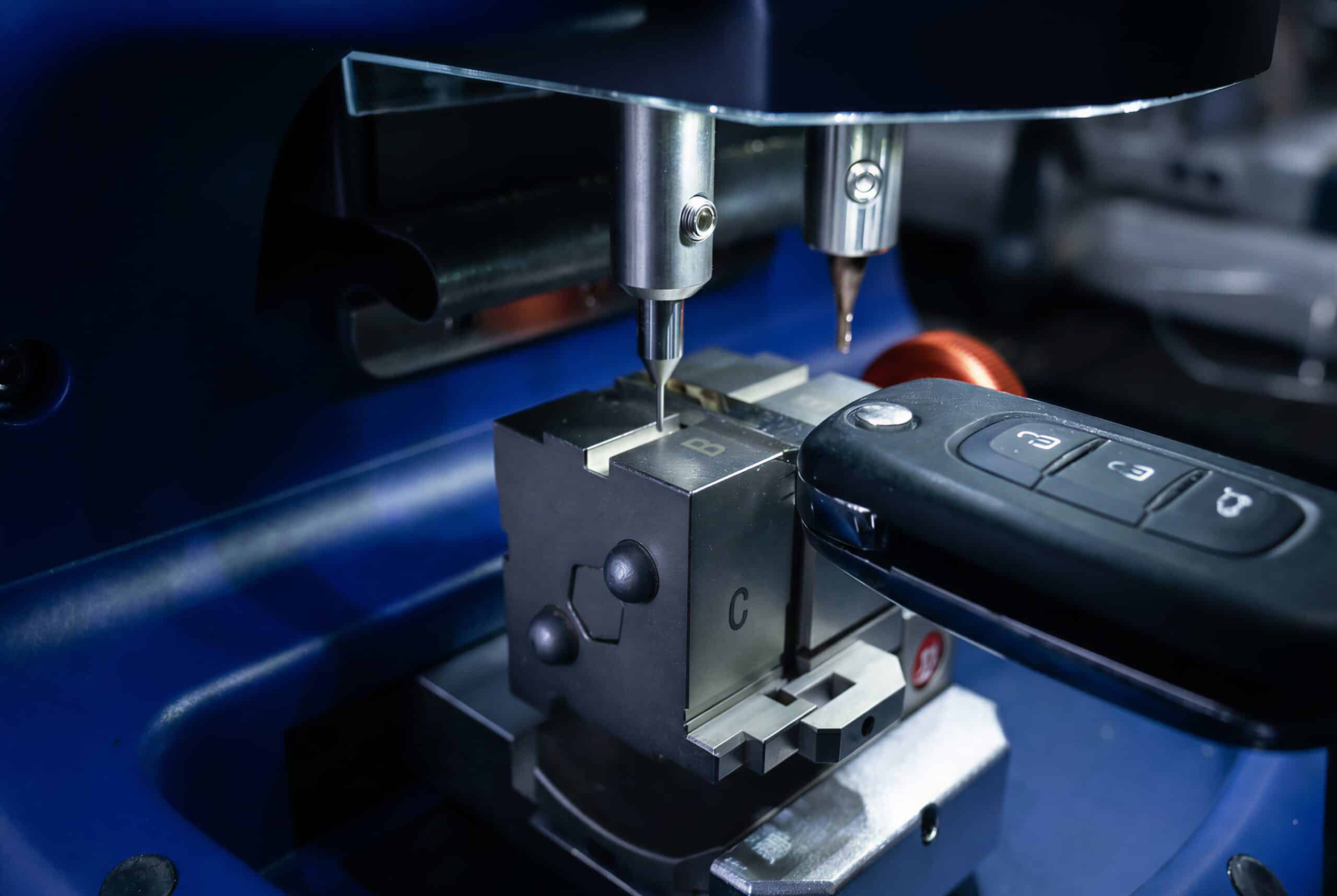 Same image, same composition, same key cutting machine, same milling cutter head, same metal vise with engraved letters, same flip key being cut, same transparent guard. Extend the image to a 3:2 landscape composition and remove any watermark or logo text.
Color grading change: shift the overall tone toward a darker, cooler, more cinematic look * deepen the blacks toward charcoal (#0D0D14), push the machine body's blue toward a deeper electric indigo-blue (#313ADD), reduce the yellow/warm tones in the metal and background, slightly desaturate the background while keeping the metal parts crisp. Keep the cutter, the vise and the key exactly as they are.
Photorealistic, realistic lighting, no light effects, no glow, no particles. {"aspect_ratio":"3:2","enable_base64_output":false,"enable_sync_mode":false,"images":["https://d2h7xmz5gqybh9.cloudfront.net/media/92dfcc16eef44f32ba09236c74f50e1f/images/1783775600879907278_r1gU3cmv.png"],"output_format":"jpeg","prompt":"Same image, same composition, same key cutting machine, same milling cutter head, same metal vise with engraved letters, same flip key being cut, same transparent guard. Extend the image to a 3:2 landscape composition and remove any watermark or logo text.nColor grading change: shift the overall tone toward a darker, cooler, more cinematic look * deepen the blacks toward charcoal (#0D0D14), push the machine body's blue toward a deeper electric indigo-blue (#313ADD), reduce the yellow/warm tones in the metal and background, slightly desaturate the background while keeping the metal parts crisp. Keep the cutter, the vise and the key exactly as they are.nPhotorealistic, realistic lighting, no light effects, no glow, no particles.","resolution":"4k"}